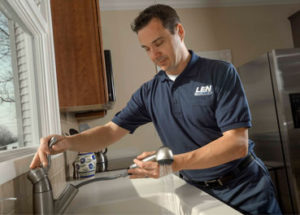 Len the Plumber in PA home fixing a faucet